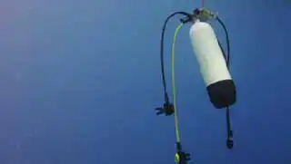 Deep Dive Specialty course safety cylinder (drop tank) seen underwater