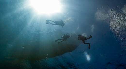 crystaldive.com-divers-surface Thailand