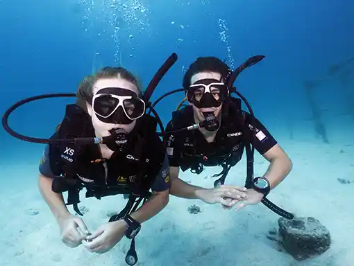 Two divers enjoying the underwater world on Koh Tao