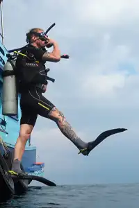 Open Water diver jumping from boat