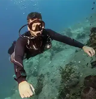 Crystal Dive sidemount instructor seen underwater on Koh Tao