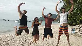 Instructor and students celebrate finishing Open Water Course at Crystal Dive Resort Koh Tao