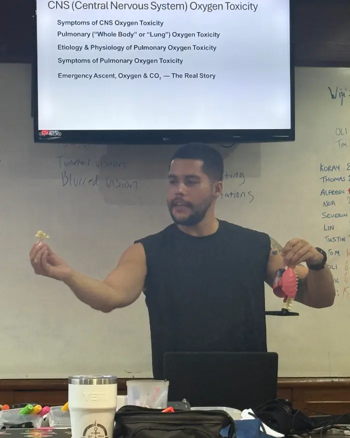 Instructor Course (ITC) candidate presenting in the Crystal Dive classroom