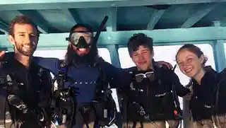 kohtaodiving.org-divemaster-course-divers-on-boat Crystal Dive fun divers and divemaster on the boat