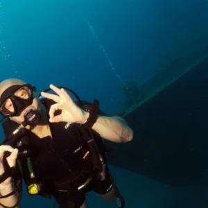 Advanced Open Water course student in front of HTMS Suphairin Wreck on Koh Tao