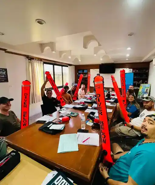 SSI Divemaster Lifestyle Candidates unpacking their diving tools in the classroom at Crystal Dive on Koh Tao