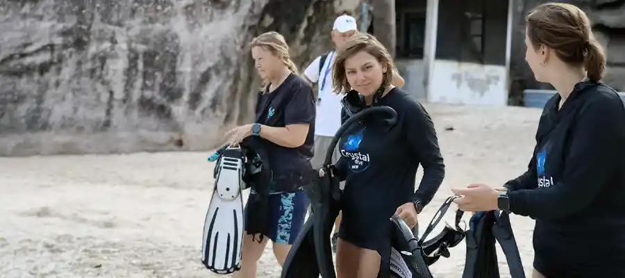 Divers preparing for a shore dive