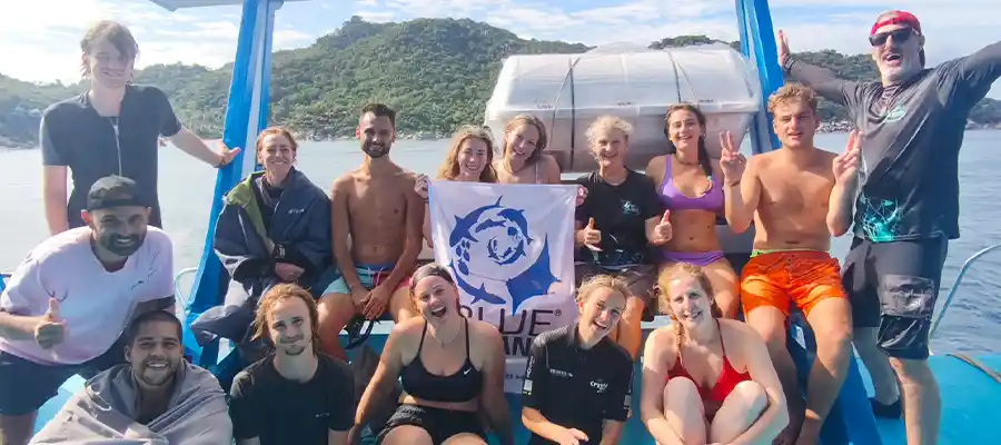 Happy divers on a boat