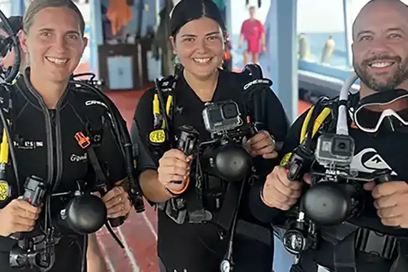 Diver Propulsion Vehicle (DPV) divers ready on the Crystal Dive boat