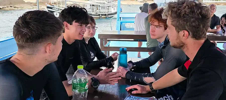 Dive boat briefing with dive instructor